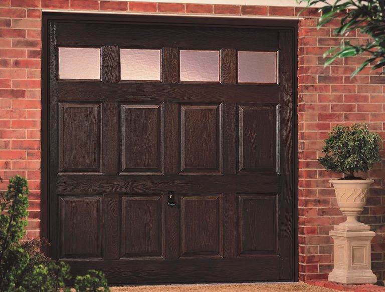 Traditional dark wood-effect up and over garage door with rectangular panel design and top glazing windows – Cristal Windows, Doors & Conservatories