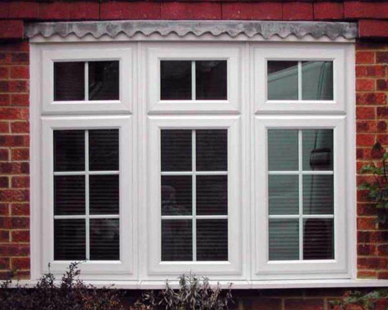 White uPVC casement bay window with Georgian bars on a red brick home - Cristal Windows, Doors & Conservatories