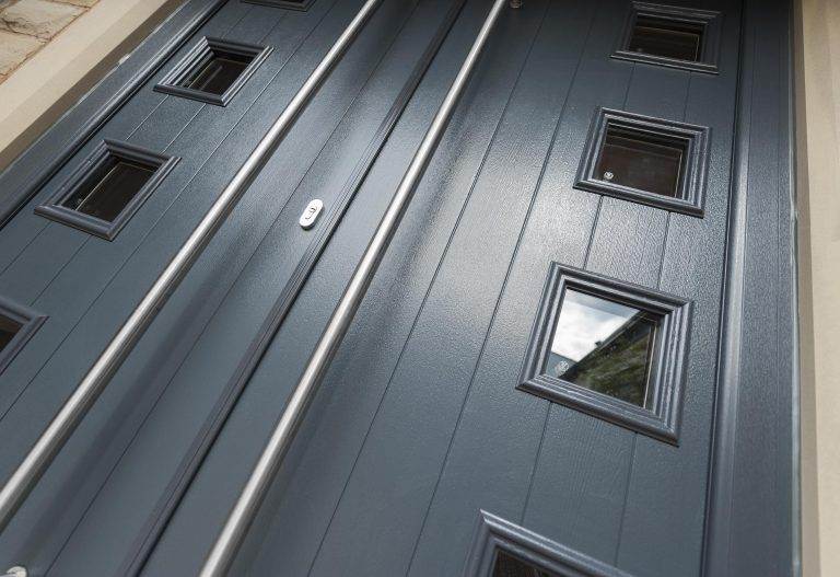 Close-up of modern dark grey composite double doors with square glazed panels and stainless steel handles – Cristal Windows, Doors & Conservatories