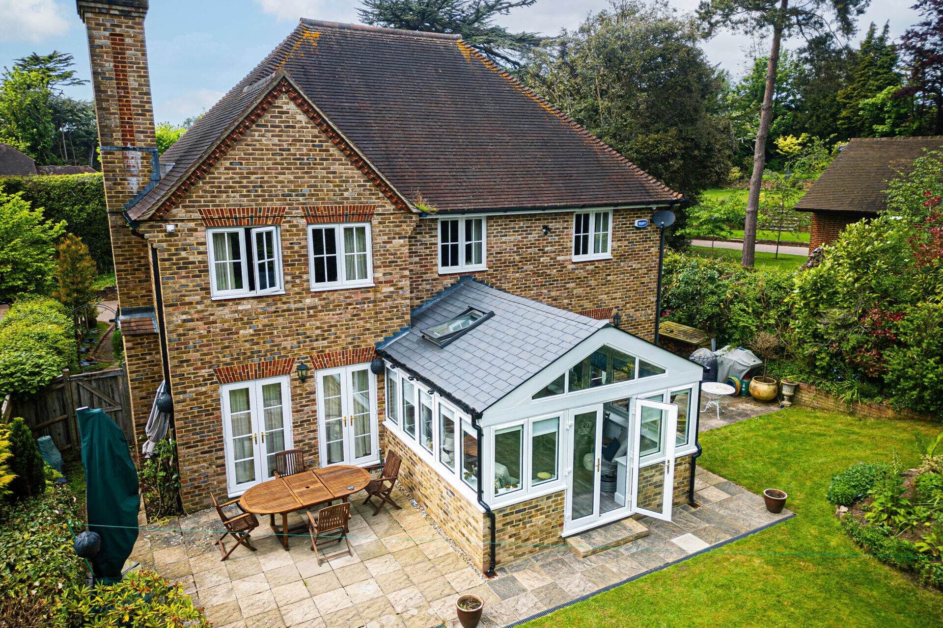 UK home with double glazed windows and conservatory designed to improve energy efficiency and reduce heating bills – Cristal Windows, Doors & Conservatories