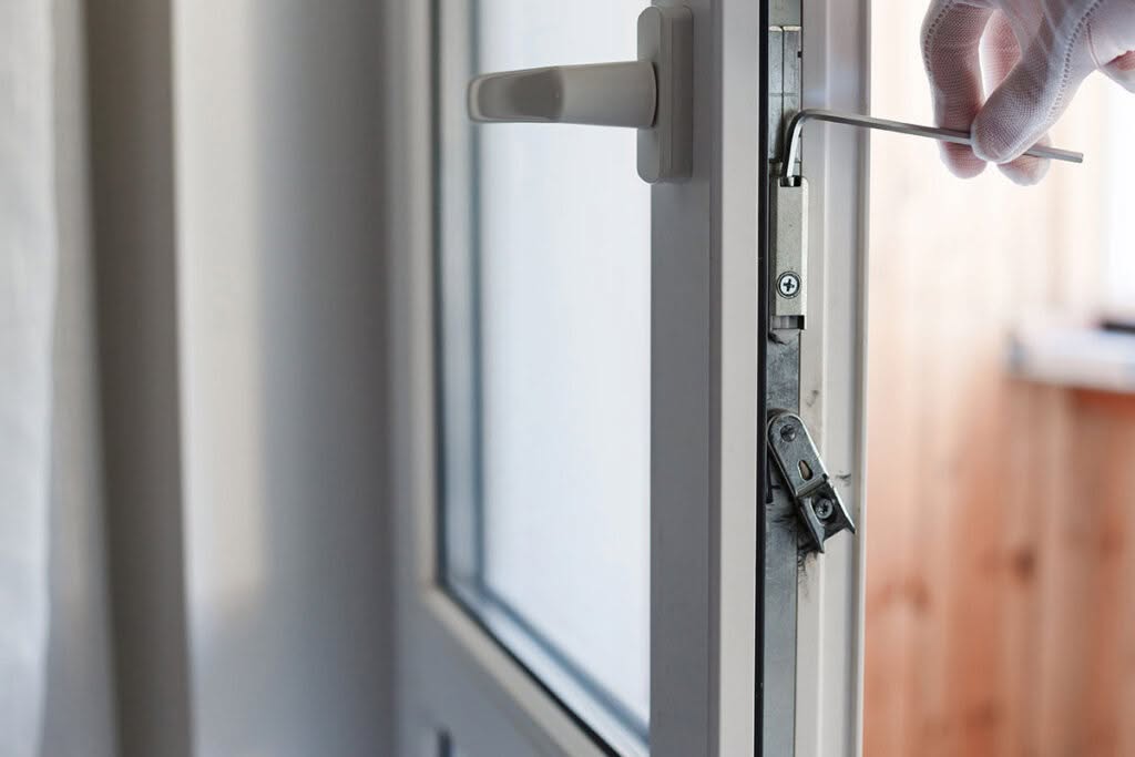 Installer Demonstrating Double Glazed Window Operation to Homeowner